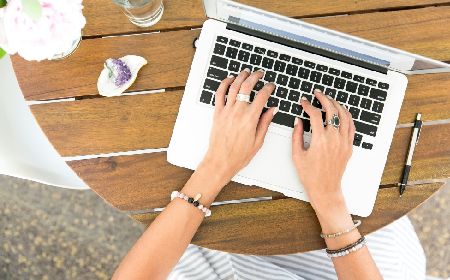 Woman typing on laptop